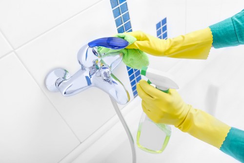 Local cleaner preparing an Airbnb property for the next guest in Merton